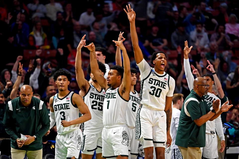 Michigan State Spartans forward Marcus Bingham Jr. (30) and the Michigan State Spartans bench celebrate during the second half against the Davidson Wildcats during the first round of the 2022 NCAA Tournament at Bon Secours Wellness Arena.