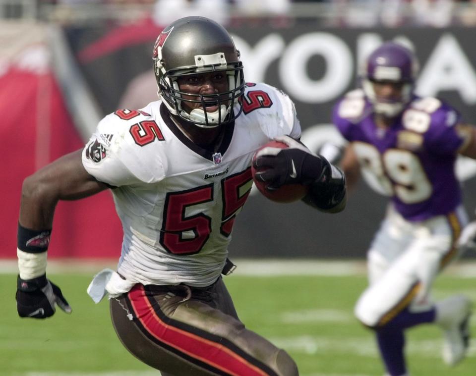 Tampa Bay linebacker Derrick Brooks runs for a touchdown Sunday after intercepting a pass from Minnesota quarterback Daunte Culpepper during the second quarter of the Bucs' 41-13 win at Raymond James Stadium. The Washington High School graduate played in Super Bowl XXXVII.