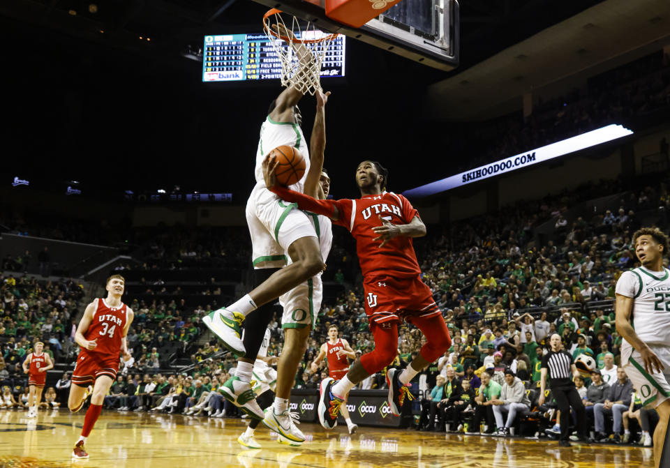 Utah guard Deivon Smith (5) shoots and misses against Oregon center N'Faly Dante (1) during the second half of an NCAA college basketball game in Eugene, Ore., Saturday, March 9, 2024. Oregon beat Utah 66-65. (AP Photo/Thomas Boyd)