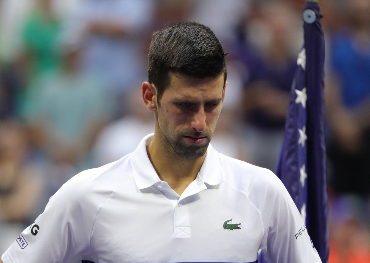 Serbia's Novak Djokovic waits for the trophy ceremony after losing to Russia's Daniil Medvedev during their 2021 US Open Tennis tournament men's final match at the USTA Billie Jean King National Tennis Center in New York, on September 12, 2021. (Photo by Kena Betancur / AFP) (Photo by KENA BETANCUR/AFP via Getty Images)