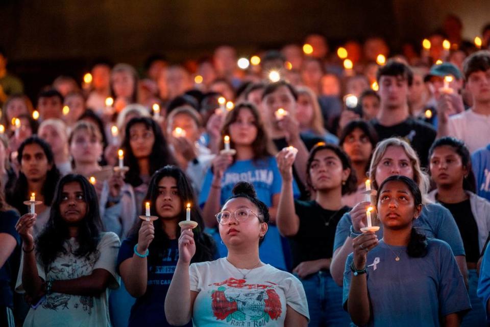 UNC-Chapel Hill students, faculty and family hold a candlelight vigil Friday, Aug 30, 2023 at the Dean Smith Center in honor of professor Zijie Yan who was shot and killed on campus on Monday.