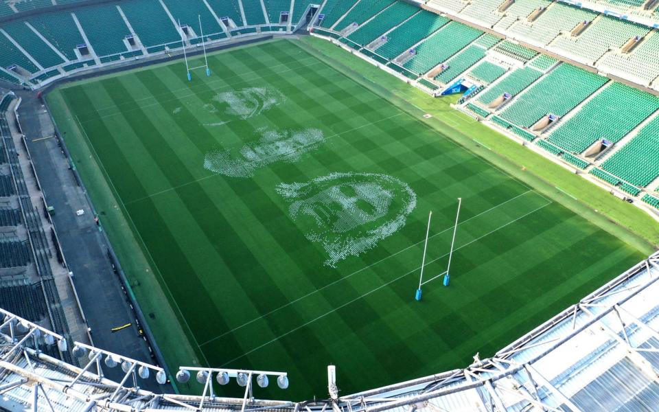 Portraits of Joe Marler, Maro Itoje and Faf de Klerk painted on the pitch at Twickenham Stadium to celebrate the restart of the Gallagher Premiership - PA