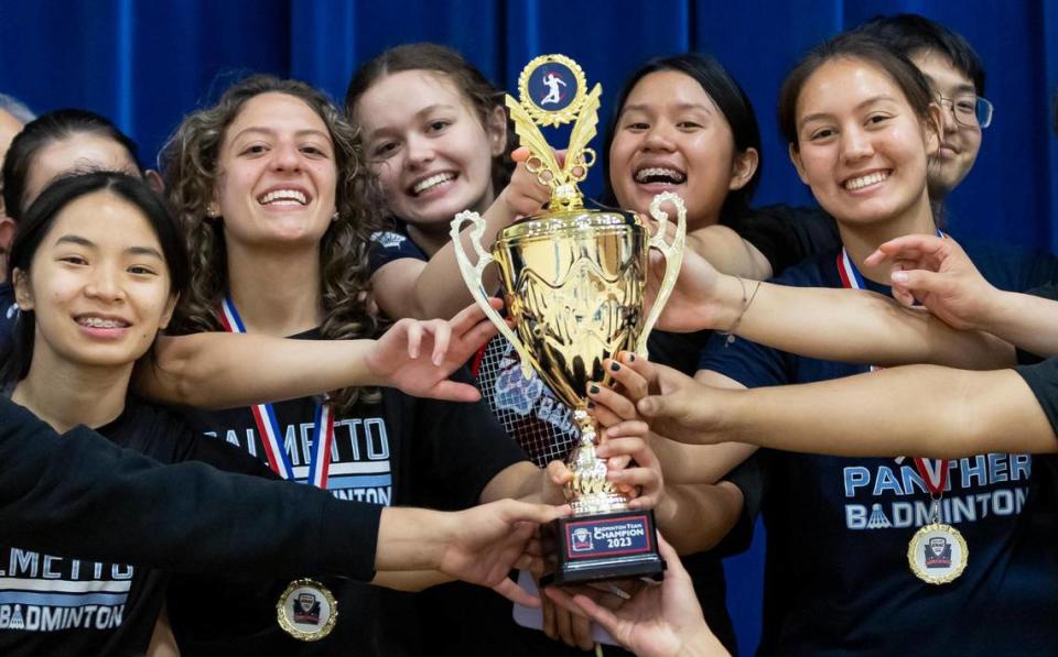 Students from Miami Palmetto Senior High School celebrate after winning the GMAC badminton championship trophy at G Holmes Braddock Senior High on Tuesday, April 18, 2023, in Miami, Fla.