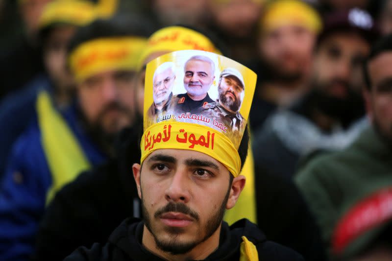 A supporter of Hezbollah attends a funeral ceremony rally to mourn Qassem Soleimani, head of the elite Quds Force, who was killed in an air strike at Baghdad airport, in Beirut's suburbs