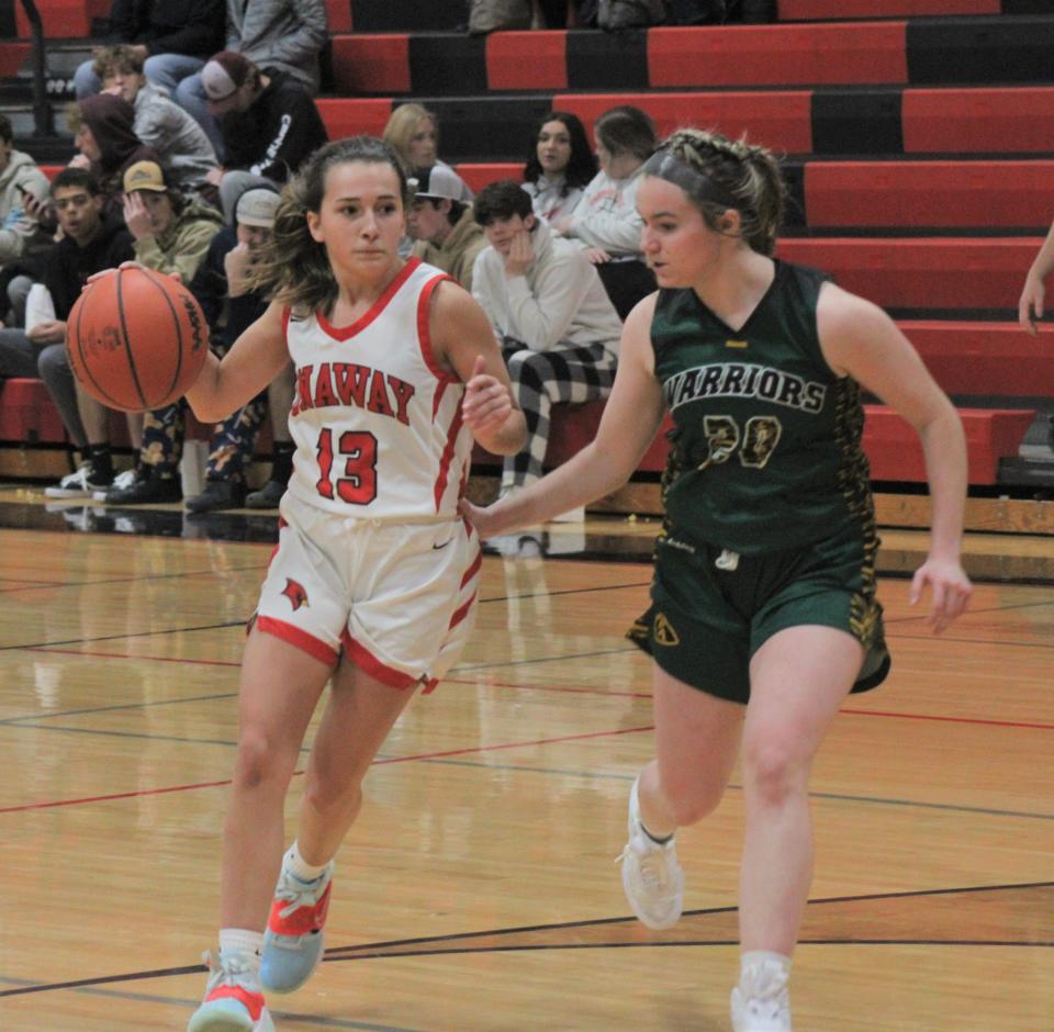 Onaway freshman guard Marley Szymoniak (13) heads for the basket while Forest Area's Jersey Patton (30) defends during the second half on Friday.