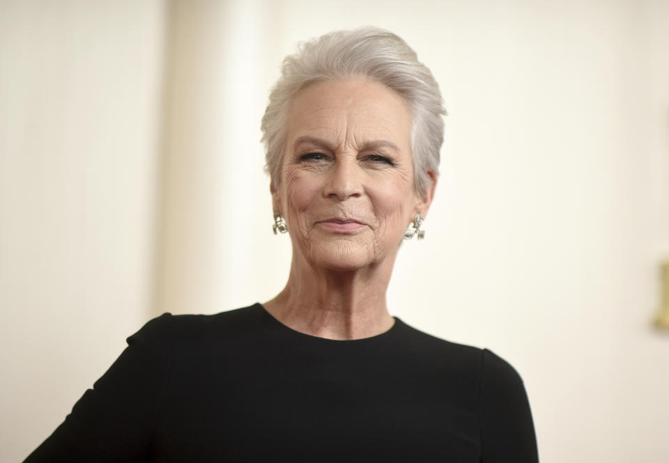 FILE - Jamie Lee Curtis arrives at the Oscars, March 10, 2024, at the Dolby Theatre in Los Angeles. New Mexico is standing in for California in a new film as Curtis’ production company and others tell the story of a bus driver and a school teacher who rescued students during the deadliest and most destructive wildfire in California’s history. (Photo by Richard Shotwell/Invision/AP, File)