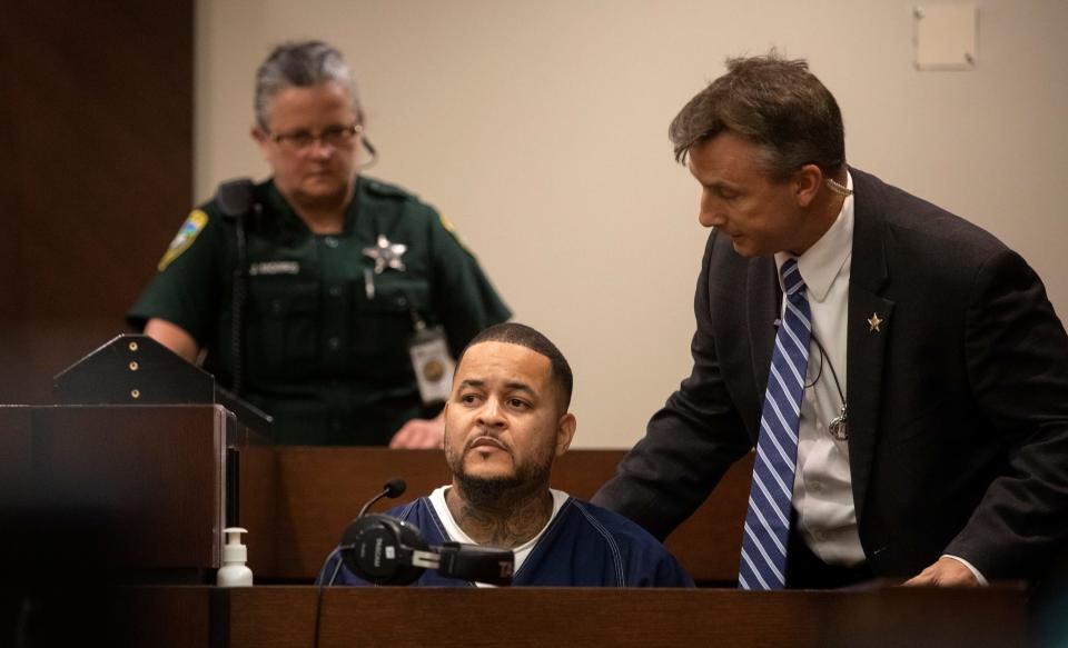 Luis Rivera, a leader in the North Miami tribe of the Latin Kings gang and a state witness, receives help adjusting his chair as he prepares to testify in the trial of Katherine Magbanua for the murder of Dan Markel on Thursday, May 19, 2022.