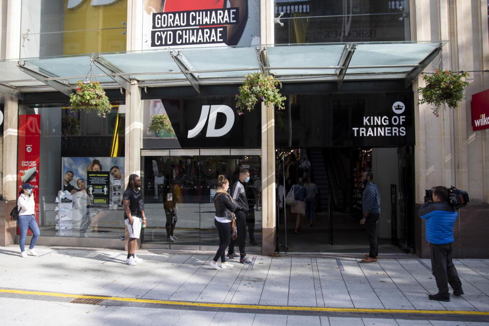 CARDIFF, WALES, UNITED KINGDOM - JUNE 22, 2020 - The first shoppers enter a newly reopened JD Sports store in Cardiff city centre as some non-essential shops reopen in Wales.- PHOTOGRAPH BY Mark Hawkins / Barcroft Studios / Future Publishing (Photo credit should read Mark Hawkins/Barcroft Media via Getty Images)