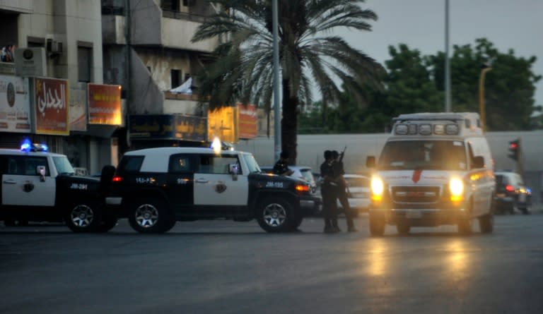 Saudi police stand guard at the site of a suicide bombing in the early hours of July 4, 2016, near the American consulate in the Red Sea city of Jeddah Security officers became suspicious of a man near the parking lot of Dr Suleiman Faqeeh Hospital, which is directly across from the US diplomatic mission. When they moved in to investigate "he blew himself up with a suicide belt inside the hospital parking" at around 2:15 am, the ministry said, adding that two security officers were lightly injured