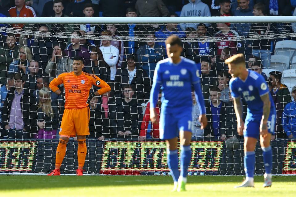 Cardiff City's English-born Filipino goalkeeper Neil Etheridge (L) reacts after conceding the opening goal during the English Premier League football match between between Cardiff City and Crystal Palace at Cardiff City Stadium in Cardiff, south Wales on  May 4, 2019. (Photo by GEOFF CADDICK / AFP) / RESTRICTED TO EDITORIAL USE. No use with unauthorized audio, video, data, fixture lists, club/league logos or 'live' services. Online in-match use limited to 120 images. An additional 40 images may be used in extra time. No video emulation. Social media in-match use limited to 120 images. An additional 40 images may be used in extra time. No use in betting publications, games or single club/league/player publications. /         (Photo credit should read GEOFF CADDICK/AFP/Getty Images)