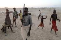 The Wider Image: When raiders menace in northern Kenya, grab your guns