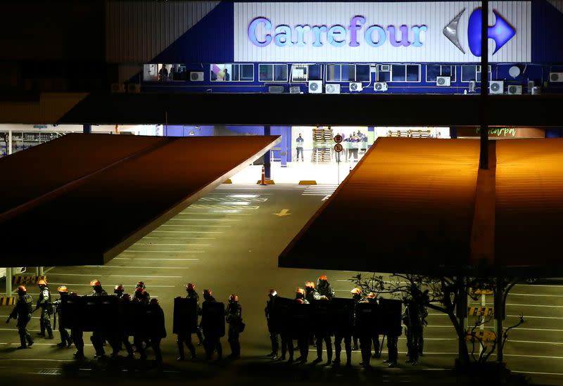 Riot police stand in formation during a protest against racism, after Joao Alberto Silveira Freitas was beaten to death by security guards at a Carrefour supermarket in Porto Alegre