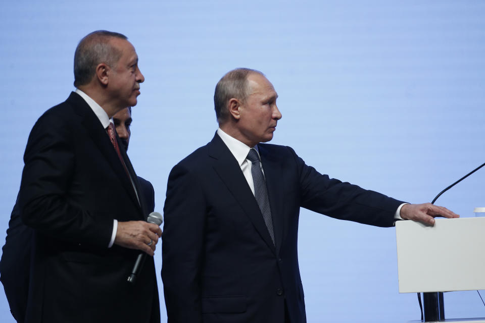 Turkey's President Recep Tayyip Erdogan, left, and Russian President Vladimir Putin, right, attend an event marking the completion of one of the phases of the Turkish Stream natural gas pipeline, in Istanbul, Monday, Nov. 19, 2018. The two 930-kilometer (578-mile) lines when finished are expected to carry 31.5 billion cubic meters (1.1 trillion cubic feet) of Russian natural gas annually to European markets, through Turkish territories. (AP Photo/Lefteris Pitarakis)