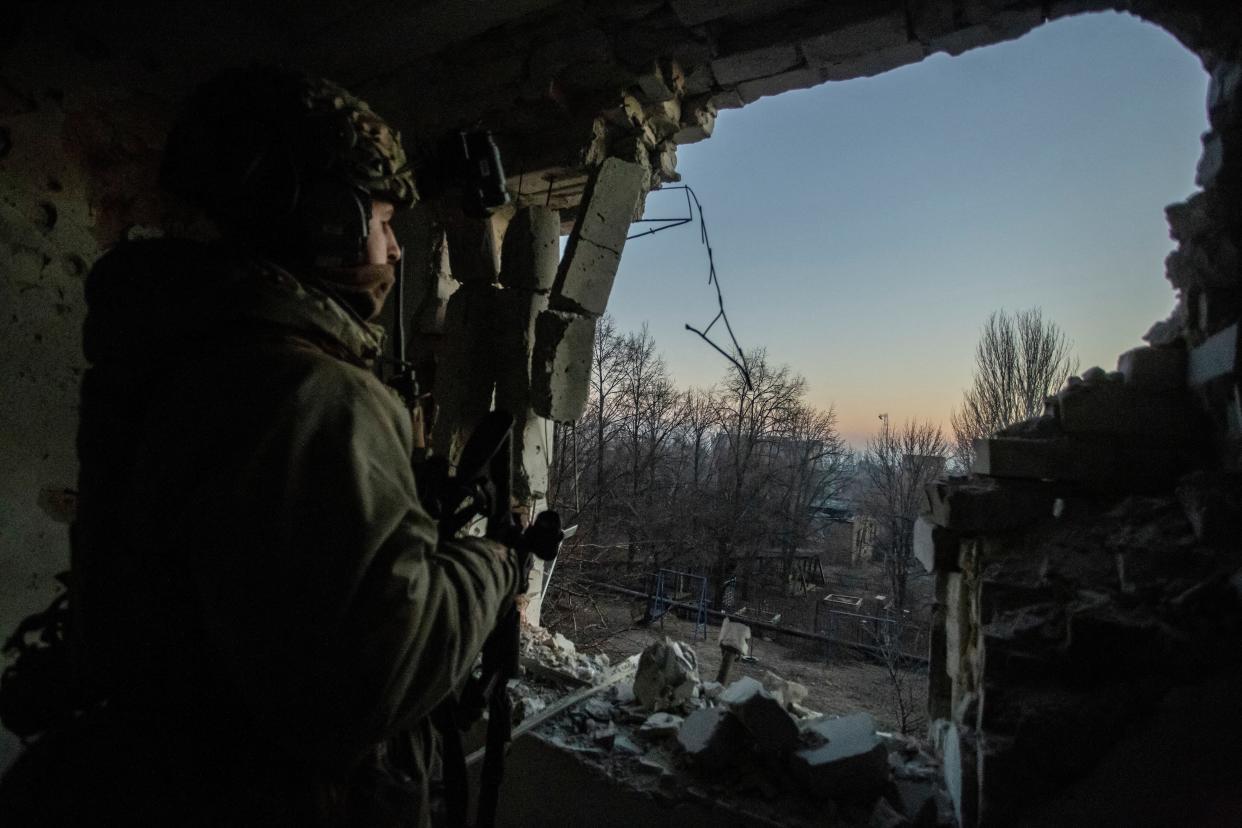 A Ukrainian serviceman looks on in Bakhmut, Donetsk (Reuters)