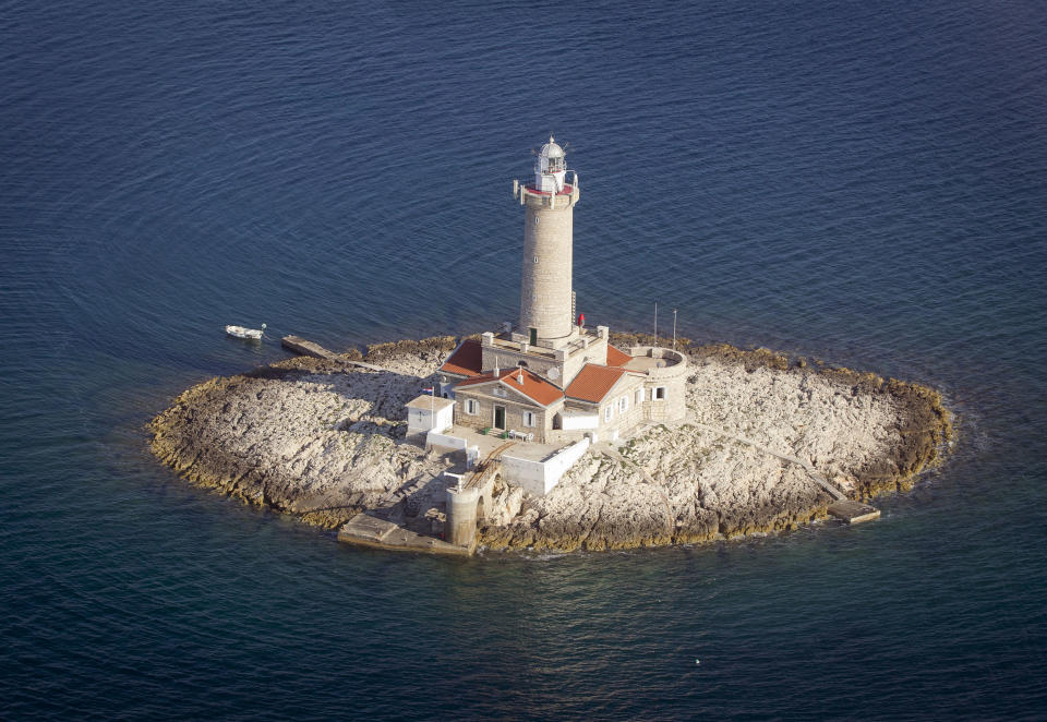 In this photo taken June 17, 2013, a lighthouse Porer in northern Adriatic is photographed from the air. The lighthouse is used for tourist accommodation. On Monday July 1, 2013, Croatia will become the 28th EU member, the bloc's first addition since Bulgaria and Romania joined in 2007. Croatia's membership marks a historic turning point for the small country, which went through carnage after declaring independence from the former Yugoslavia in 1991. (AP Photo/Darko Bandic)