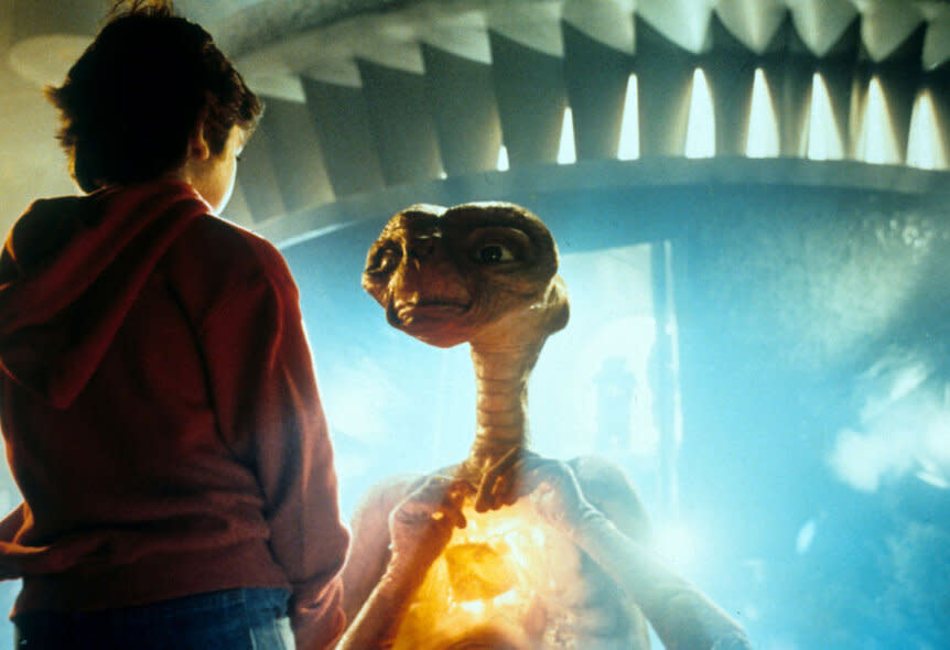 Henry Thomas talking with ET in a scene from the film 'E.T. The Extra-Terrestrial', 1982.