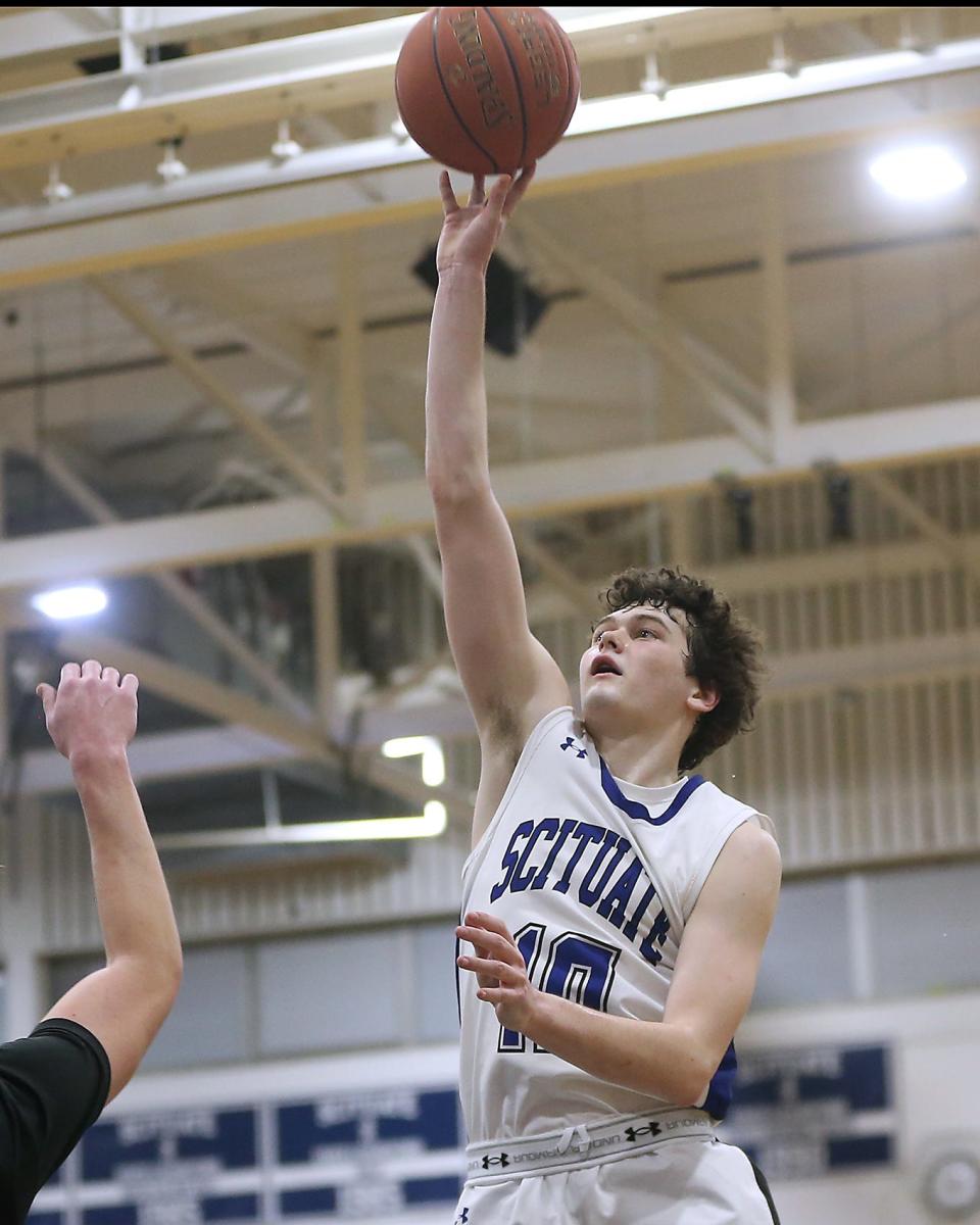 Scituate's Michael Porter goes up for a layup on a fast break opportunity after a steal during third quarter action of their game in the Round of 32 game in the Division 2 state tournament at Scituate High on Thursday, March 2, 2023.