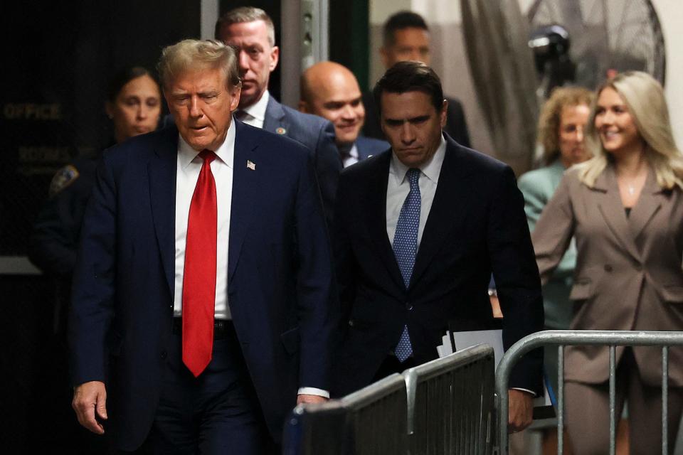 Former President Donald Trump (L) arrives for his trial for allegedly covering up hush money payments linked to extramarital affairs, at Manhattan Criminal Court in New York City on April 23, 2024. Trump faces a contempt of court hearing on Tuesday as part of his historic criminal trial, with New York prosecutors insisting the former president repeatedly violated the gag order issued to prevent him from intimidating witnesses.