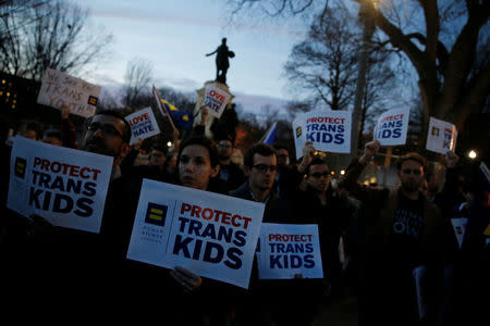 Transgender activists and supporters protest potential changes by the Trump administration in federal guidelines issued to public schools in defense of transgender student rights, near the White House in Washington, U.S. February 22, 2017. REUTERS/Jonathan Ernst