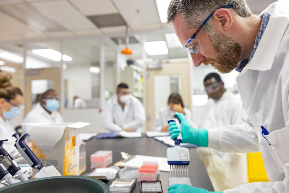 Laboratory technicians from members of the Abbott Pandemic Defense Coalition undergo training at AP8 in Abbott Park, Ill.<span class="copyright">Courtesy Abbott</span>