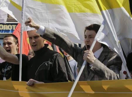 Russian nationalists wave flags and shout slogans as they take part in a May Day rally in Moscow May 1, 2014. REUTERS/Tatyana Makeyeva