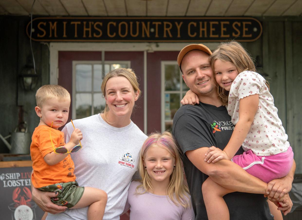 Allie and Jake Catlin with their children Will, 2, Samantha, 8, and Sadie, 6, outside their Smith's Country Cheese Thursday.