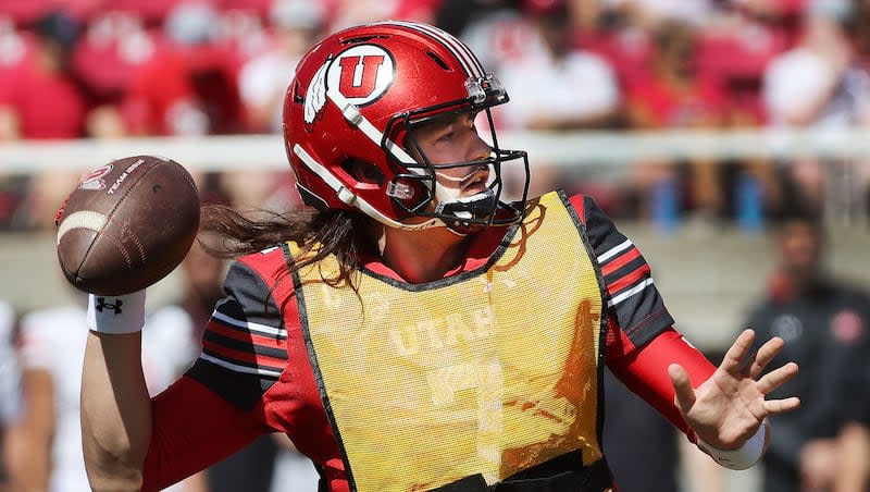 Utah Utes quarterback Cameron Rising (7) throws a touchdown pass during the 22 Forever game scrimmage in Salt Lake City on Saturday, April 13, 2024.