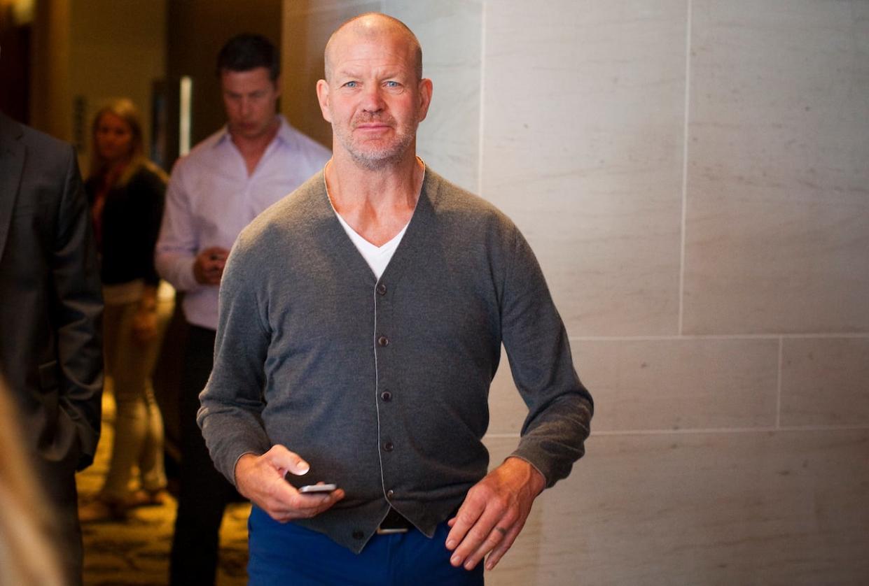 Lululemon founder Chip Wilson, pictured right, is yet again facing controversy after expressing objections to Forbes about the athletic wear company's diversity and inclusivity efforts.  (Ben Nelms/Reuters - image credit)
