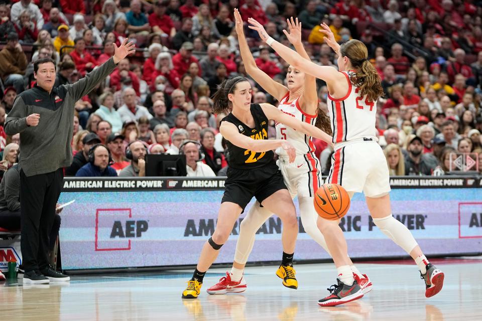 Ohio State guards Emma Shumate (5) and Taylor Mikesell (24) defend Iowa's Caitlin Clark during the second half of the 2023 matchup between the two teams at Value City Arena. Ohio State lost 83-72.