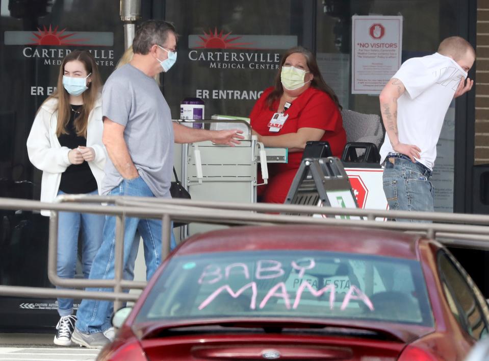 Visitors leave a screening station for coronavirus in front of the emergency department at Cartersville Medical Center on March 17 in Georgia.