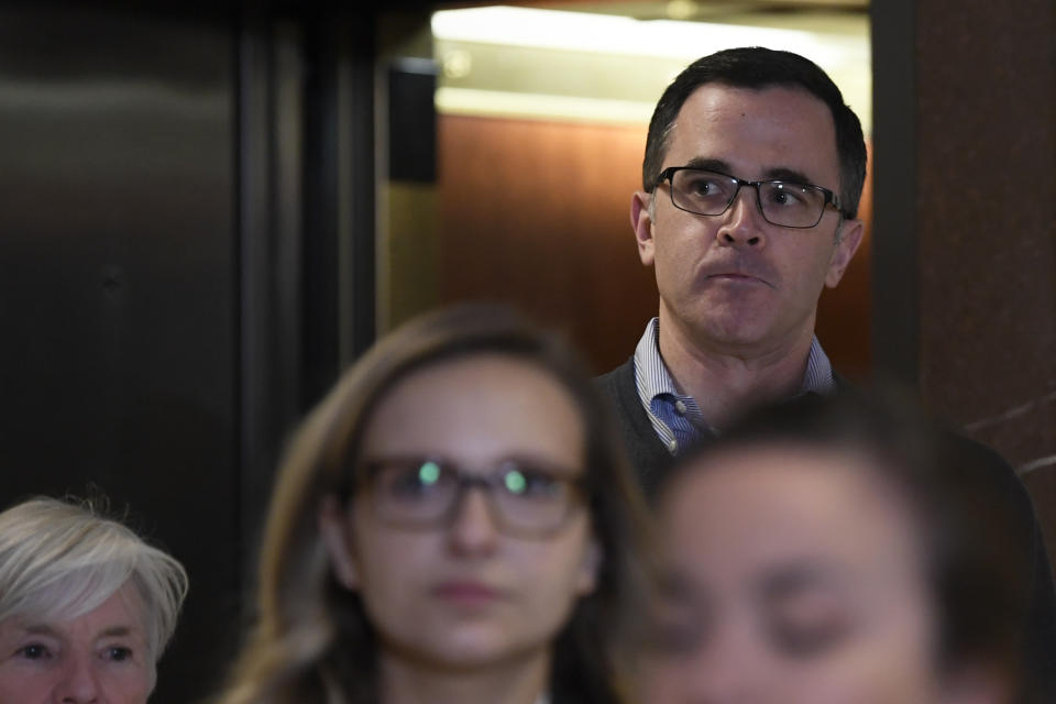 Tim Morrison, the top Russia official on President Trump's National Security Council, gets off of an elevator as he returns to Capitol Hill in Washington, Wednesday, Nov. 6, 2019, to review his testimony before the House impeachment inquiry last week. (AP Photo/Susan Walsh)