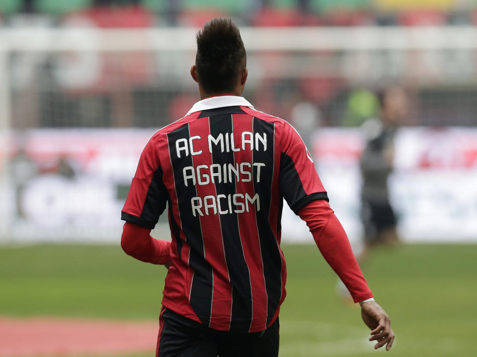 FILE - AC Milan midfielder Kevin-Prince Boateng sports a jersey reading "AC Milan against racism" prior to the start of the Serie A soccer match between AC Milan and Siena at the San Siro stadium in Milan, Italy, Sunday, Jan. 6, 2013. Kevin-Prince Boateng set soccer on a path toward tougher sanctions in cases of discrimination when he walked off the field to protest racial abuse by an opposing team's fans a decade ago. His teammates had his back when he refused to tolerate the abuse from fans of a small provincial Italian club during a mid-season exhibition game in 2013. (AP Photo/Antonio Calanni, File)