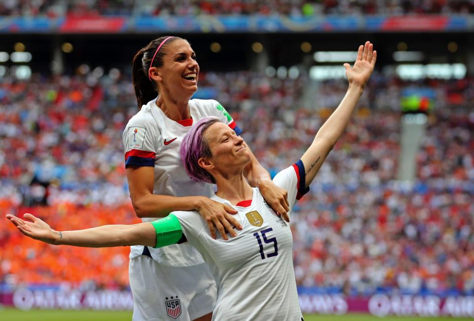 Megan Rapinoe and Alex Morgan celebrate a goal during the 2019 World Cup.