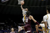 Texas A&M forward Ethan Henderson (10) touches the eye of LSU guard Eric Gaines (2) during the first half of an NCAA college basketball game in Baton Rouge, La., Wednesday, Jan. 26, 2022. (AP Photo/Matthew Hinton)