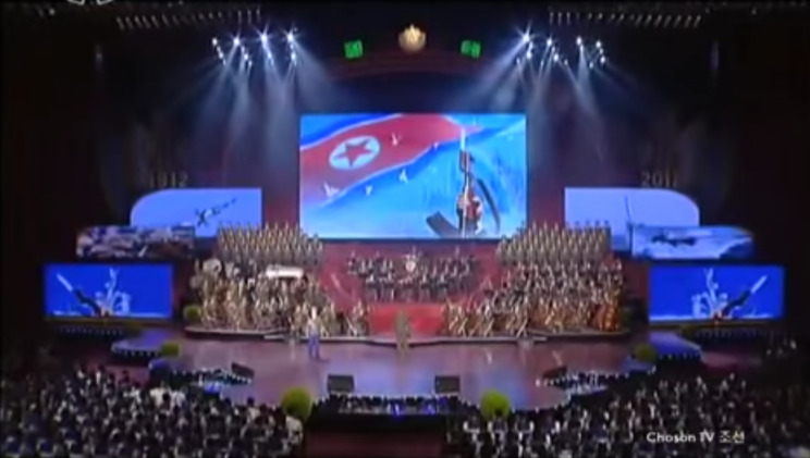 Footage has emerged of a rousing classical concert in North Korea featuring images that appear to show a nuclear bomb being dropped on America.