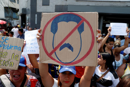 Supporters of Venezuelan opposition leader Juan Guaido, who many nations have recognized as the country's rightful interim ruler, take part in a protest against Venezuelan President Nicolas Maduro's government in Caracas, Venezuela, April 10, 2019. REUTERS/Carlos Garcia Rawlins