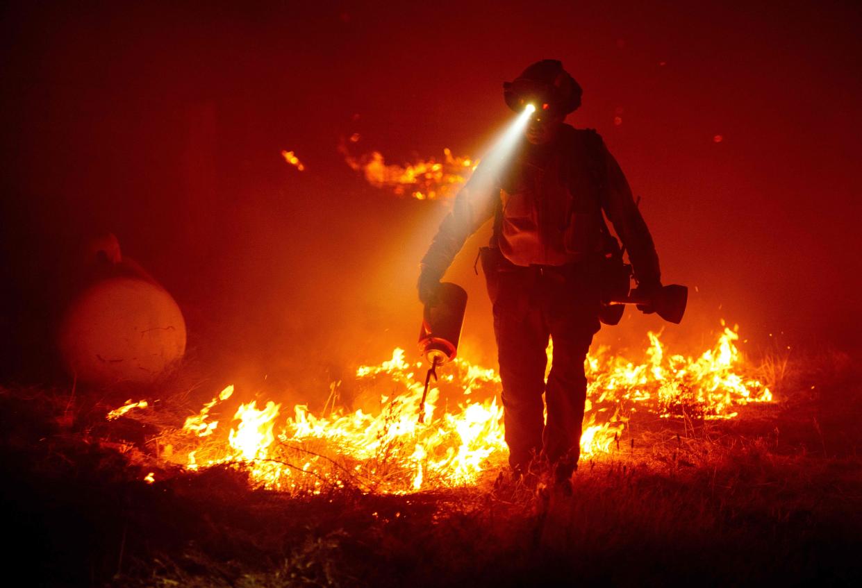 Firefighters are tackling hundreds of blazes across three states (AFP via Getty Images)