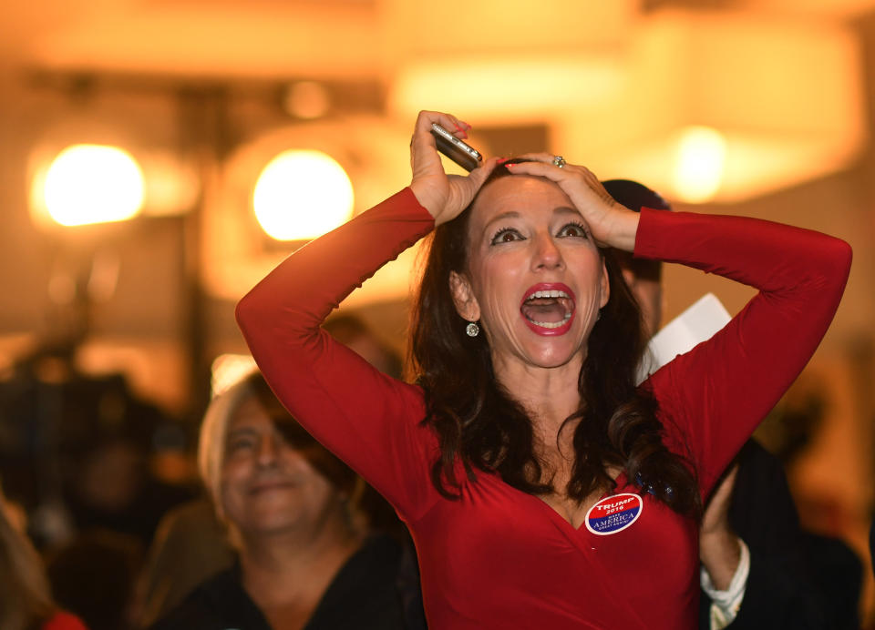 Mia Hofmann, Trump supporter, celebrates returns coming in during the Colorado Republican Election Night party at the DoubleTree Hilton in the Denver Tech Center, on Nov. 8.