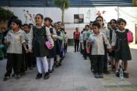 Pupils line up in the courtyard of the Mahaba school, which was founded 30 years ago by the pioneering anti-poverty activist Sister Emmanuelle