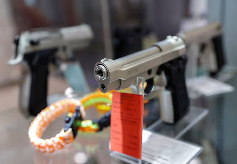 Gas pistols are displayed at a Hungarian gun shop where people queued up to buy weapons for protection amid the coronavirus pandemic