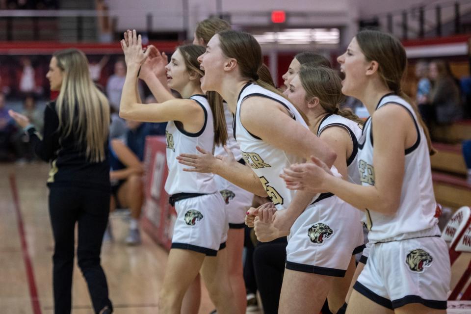 The Wildcats bench cheers as the Reitz Panthers play the Jasper Wildcats during the semifinal round of the 2023 IHSAA Class 4A Girls Basketball Sectional at Harrison High School in Evansville, Ind., Friday, Feb. 3, 2023.
