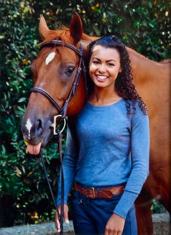 <p>Courtesy Malika Andrews</p> Malika Andrews in 2001 with horse Dante.