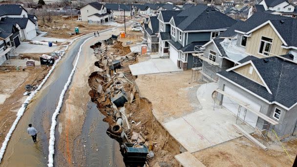 PHOTO: Local officials issued evacuation orders for at least 20 homes as temperatures spiked and snowmelt coursed through the streets on April 12, 2023, in Kaysville, Utah. (Rick Bowmer/AP, FILE)