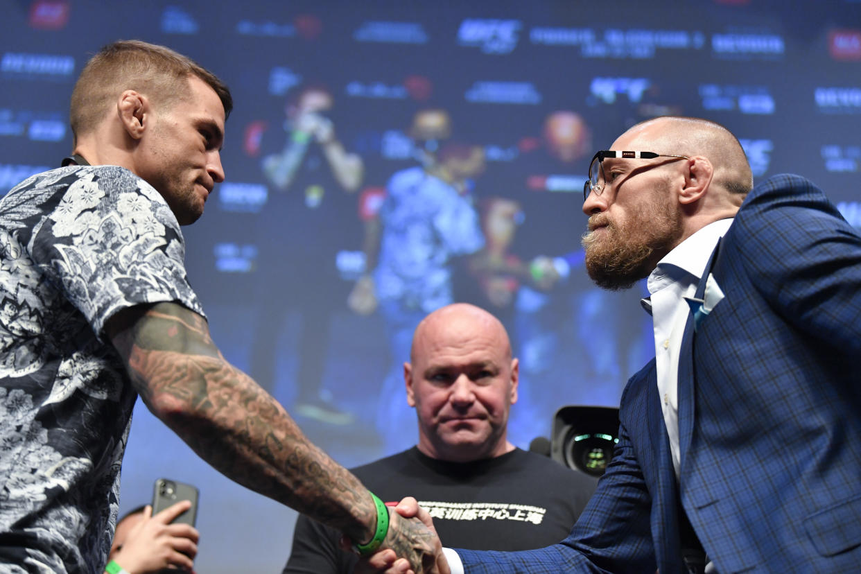 ABU DHABI, UNITED ARAB EMIRATES - JANUARY 21:  (L-R) Dustin Poirier and Conor McGregor face off during the UFC 257 Press Conference inside Etihad Arena on UFC Fight Island on January 20, 2021 in Yas Island, Abu Dhabi, United Arab Emirates. (Photo by Chris Unger/Zuffa LLC via Getty Images)