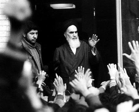 The late leader and founder of the Islamic revolution Ayatollah Ruhollah Khomeini waves from a balcony of the Alavi school in Tehran during the country's revolution in this February 1979 file photo. REUTERS/Handout/Files