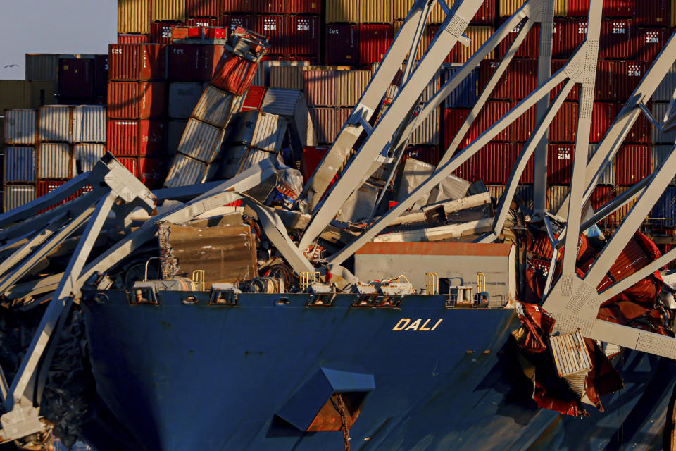 Wreckage of the Francis Scott Key Bridge rests on the container ship Dali, Saturday, March 30, 2024, in Baltimore. (AP Photo/Julia Nikhinson)