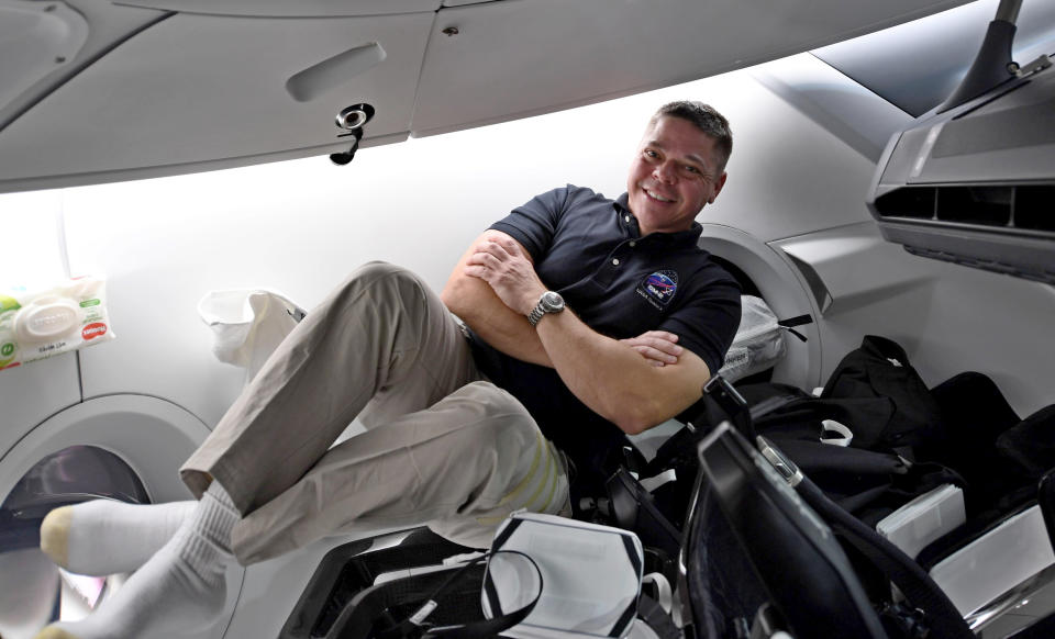 This image made available by NASA astronaut Bob Behnken on Friday, July 31, 2020, shows him inside the SpaceX Crew Dragon spacecraft docked to the International Space Station. SpaceX and NASA plan to bring Behnken and Doug Hurley back Sunday afternoon, aiming for splashdown in the Gulf of Mexico just off the Florida Panhandle. (NASA via AP)