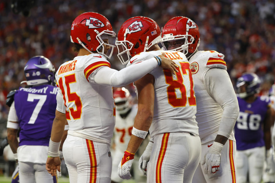 Kansas City Chiefs tight end Travis Kelce (87) celebrates with teammate quarterback Patrick Mahomes, left, after catching a 4-yard touchdown pass during the second half of an NFL football game against the Minnesota Vikings, Sunday, Oct. 8, 2023, in Minneapolis. (AP Photo/Bruce Kluckhohn)
