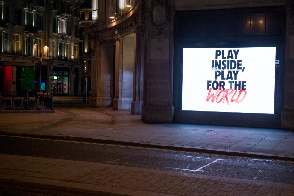 LONDON, ENGLAND - MARCH 24: London’s flagship London Store Nike Town on Oxford Street showing the new Nike play Inside, Play for the world campaign. Nike’s COVID-19 community response has committied over $15 million to response efforts and Nike’s co-founder Phil Knight and wife Penny, executive chairman of the board Mark Parker and wife Kathy, and the brand’s current president CEO John Donahoe and wife Eileen have personally pledged to donating a combined $10 million towards the efforts. British Prime Minister, Boris Johnson, announced strict lockdown measures urging people to stay at home and only leave the house for basic food shopping, exercise once a day and essential travel to and from work. The Coronavirus (COVID-19) pandemic has spread to at least 182 countries, claiming over 10,000 lives and infecting hundreds of thousands more.