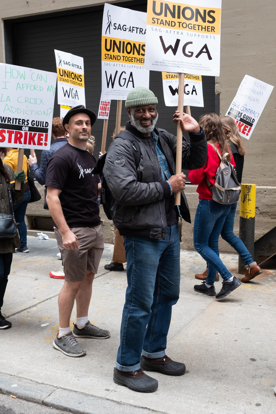 two men at the WGA strike posing for a photo